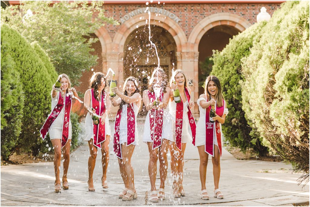 Champagne spray grad photos with Sorority Sisters at Chico State University by Ashley Carlascio Photography