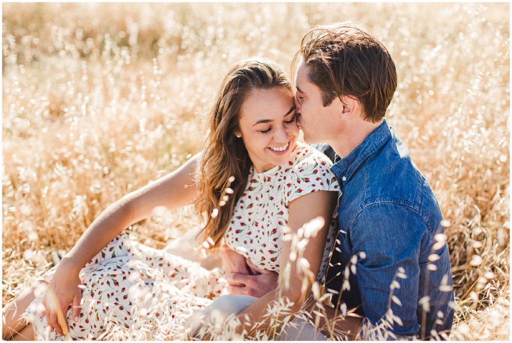 Golden engagement photos in a beautiful sunny California field by Ashley Carlascio Photography.