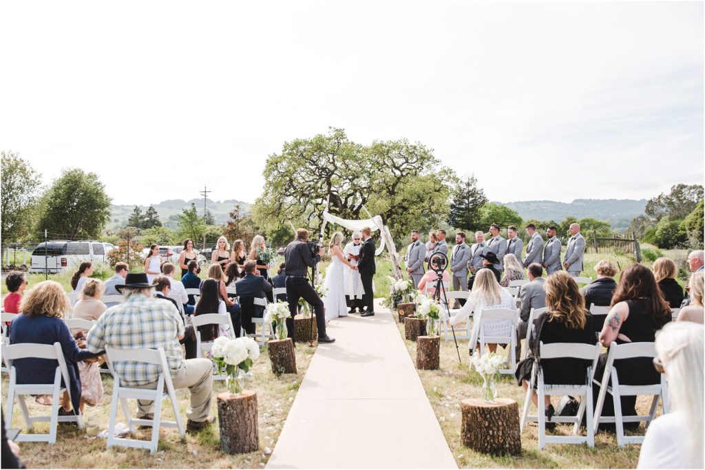 A Sonoma backyard wedding with chic, classic details, and vineyard views by Ashley Carlascio Photography