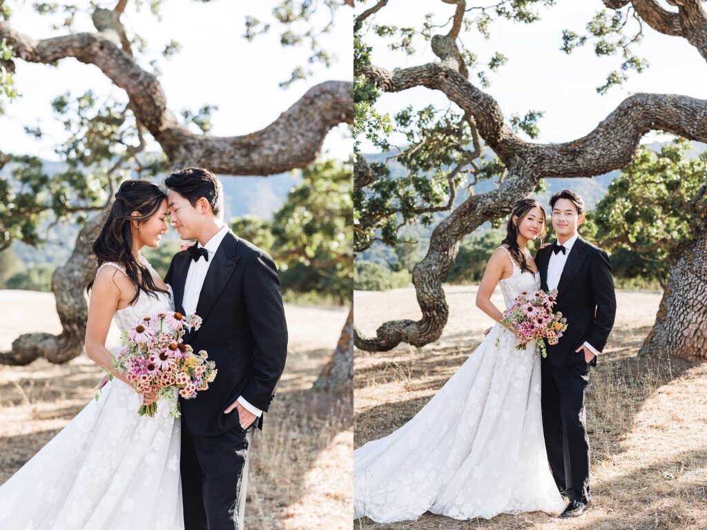 Bride and groom standing under sprawling oak tree at Holman Ranch in Carmel Valley, wedding portrait with mountains in the background.